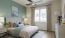 a bedroom with a large window