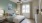 a bedroom with a large window